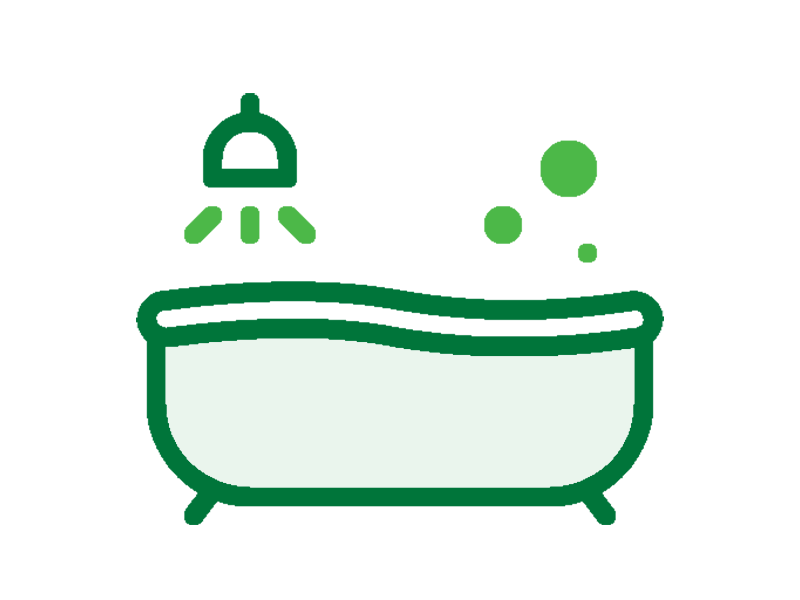 Graphic of a bath tub with a showerhead above the left side of the tub.